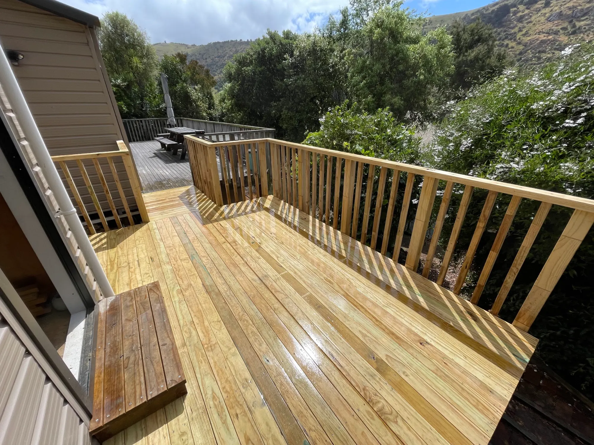 Pine deck and balustrade on a slope