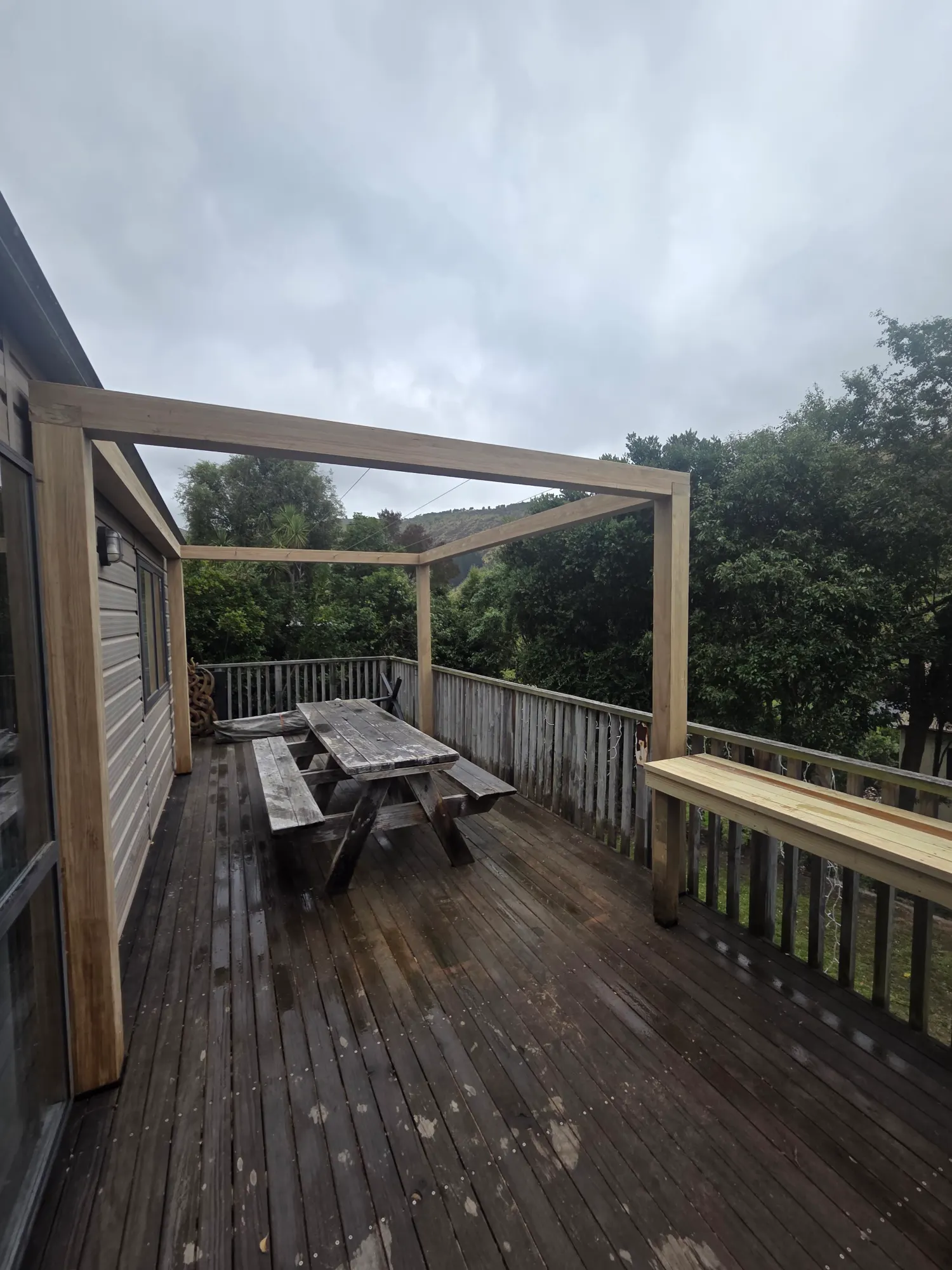 Deck with bench seating and pergola